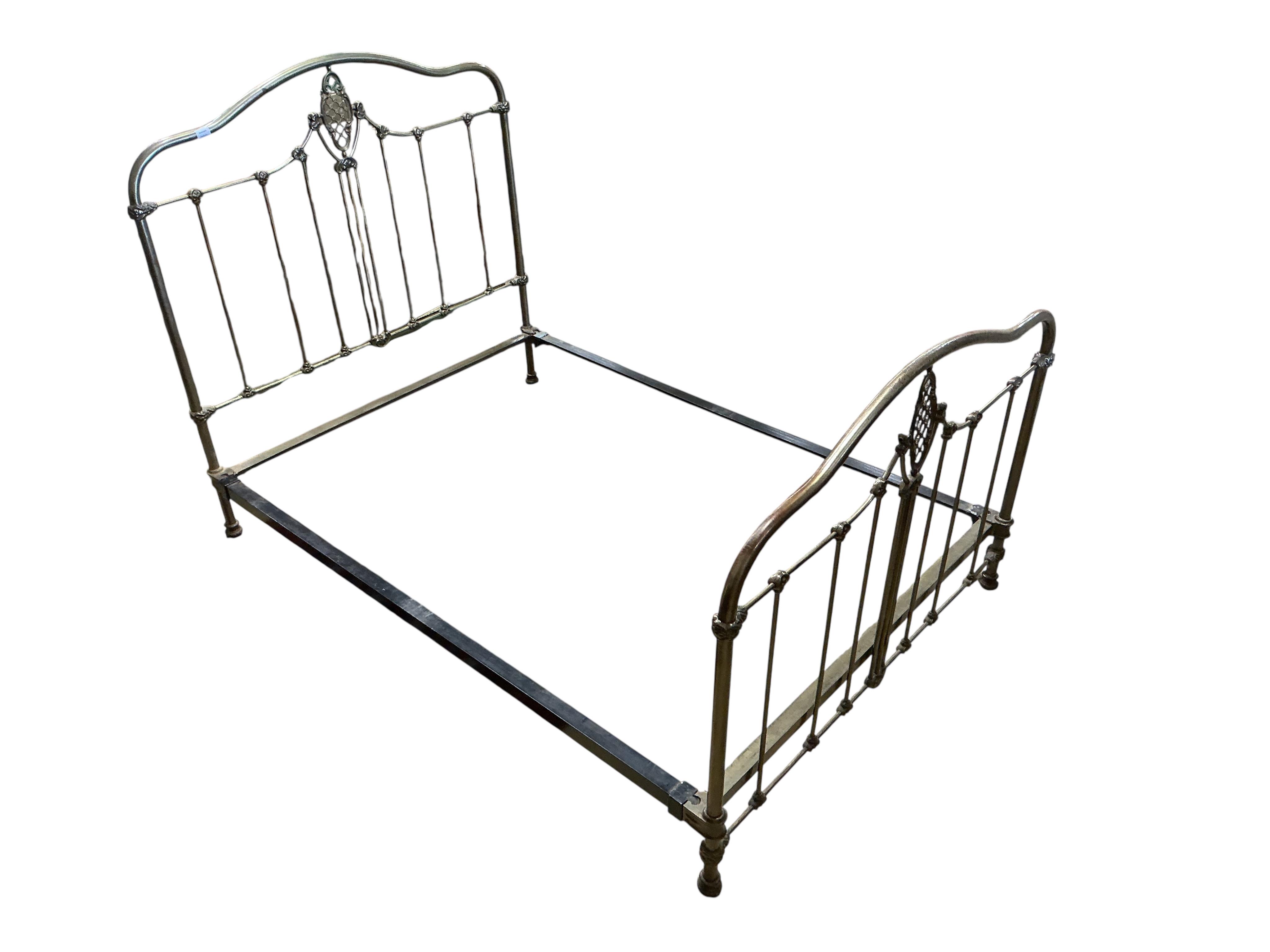 A Victorian style metal bedframe, width 138cm, length 202cm, height 136cm